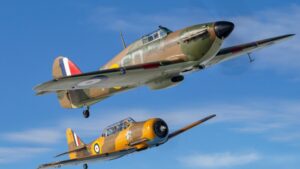 Harvard Hurricane formation flight T-6 Harvard flying in formation with a Battle of Britain Hawker Hurricane during a WWII warbird experience flight
